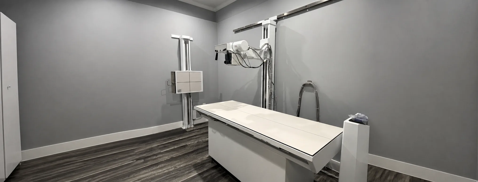 The Miami clinic's real X-ray room, shown in an AI-assisted panoramic reframe.